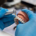 A denture being repaired quick by a skilled technician